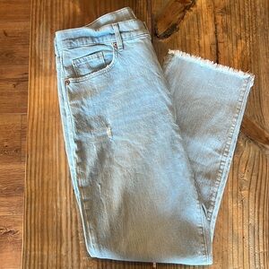 Loft Light Washed Denim with slight distressing and raw hem.  Size 8